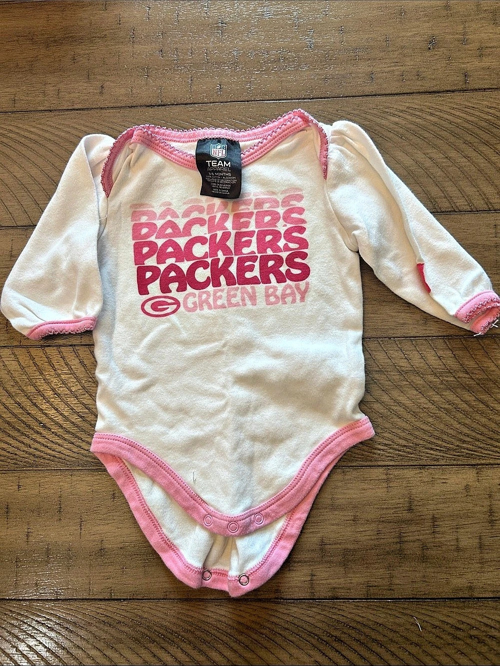 3-6M Baby Girl NFL Green Bay Packers Long Sleeve Bodysuit in White & Pink